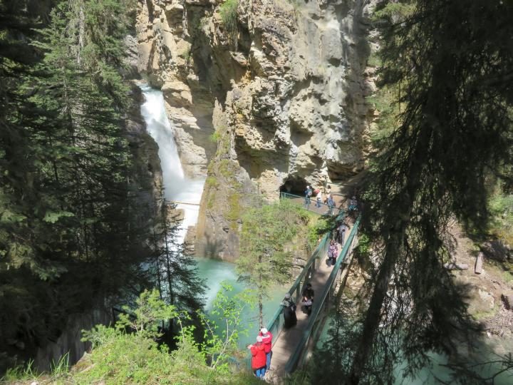 Tourists visiting Lower Falls at Johnston Canyon Banff, one of the most popular hikes