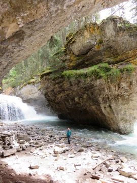Secret hiking trail leads to scenic waterfall and hidden cave in Johnston Canyon Banff